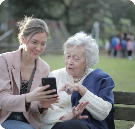 Photo of elderly and youth using tech